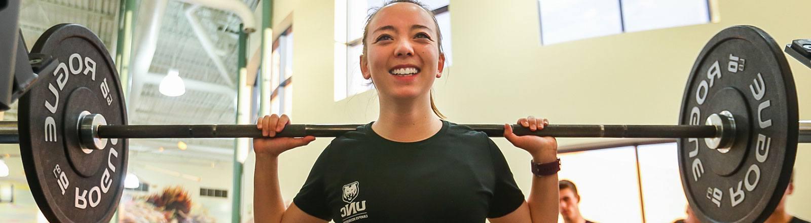 Person participating in crossfit lifting weights